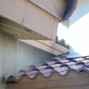 Roof line overhang or a cubby that has had galvanized bird screen installed to prevent nesting.